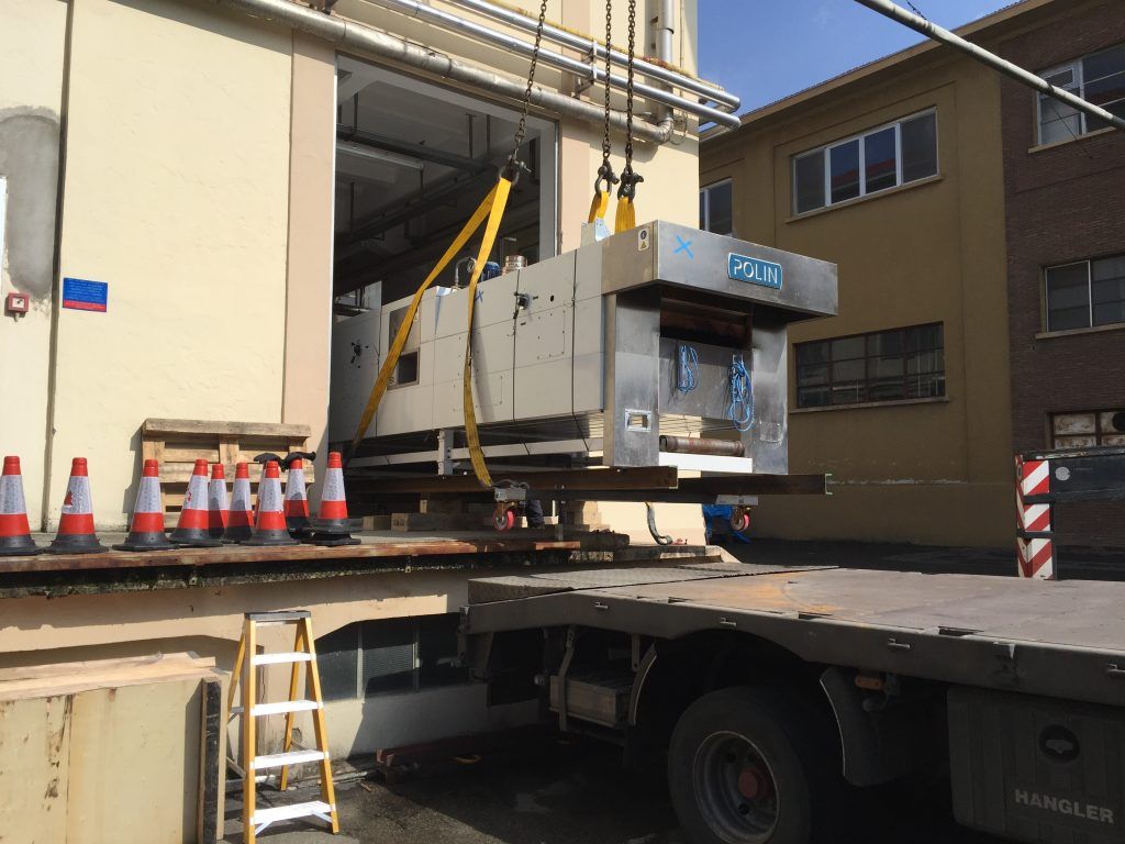 Moving a process oven as part of a pilot plant relocation.